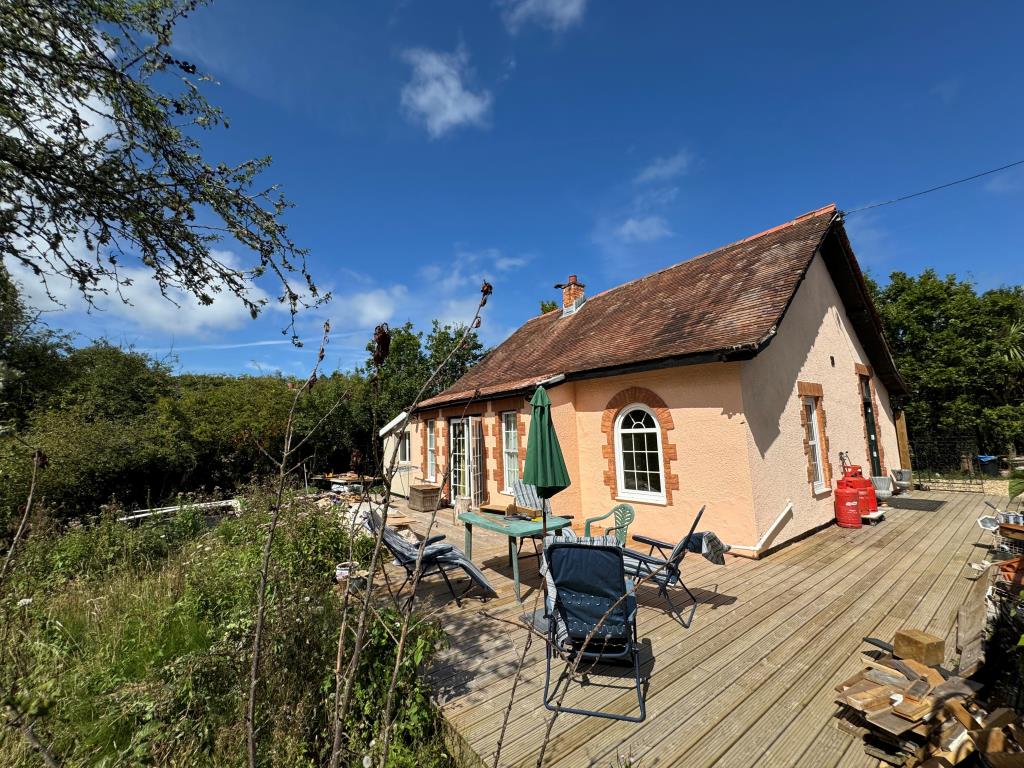 Lot: 80 - DETACHED BUNGALOW WITH POTENTIAL ON 1.6 ACRE PLOT - A View of the Side and Rear Elevations